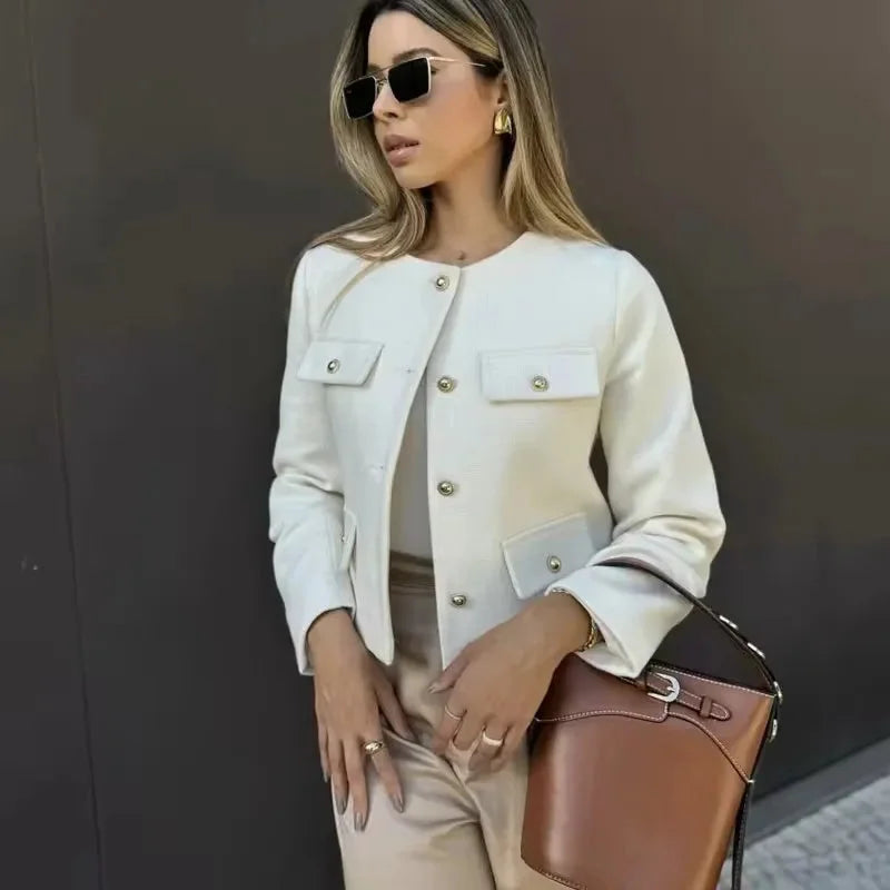 Women's cropped jacket featuring a button front, side pockets, and made of durable cotton blend for stylish everyday wear.