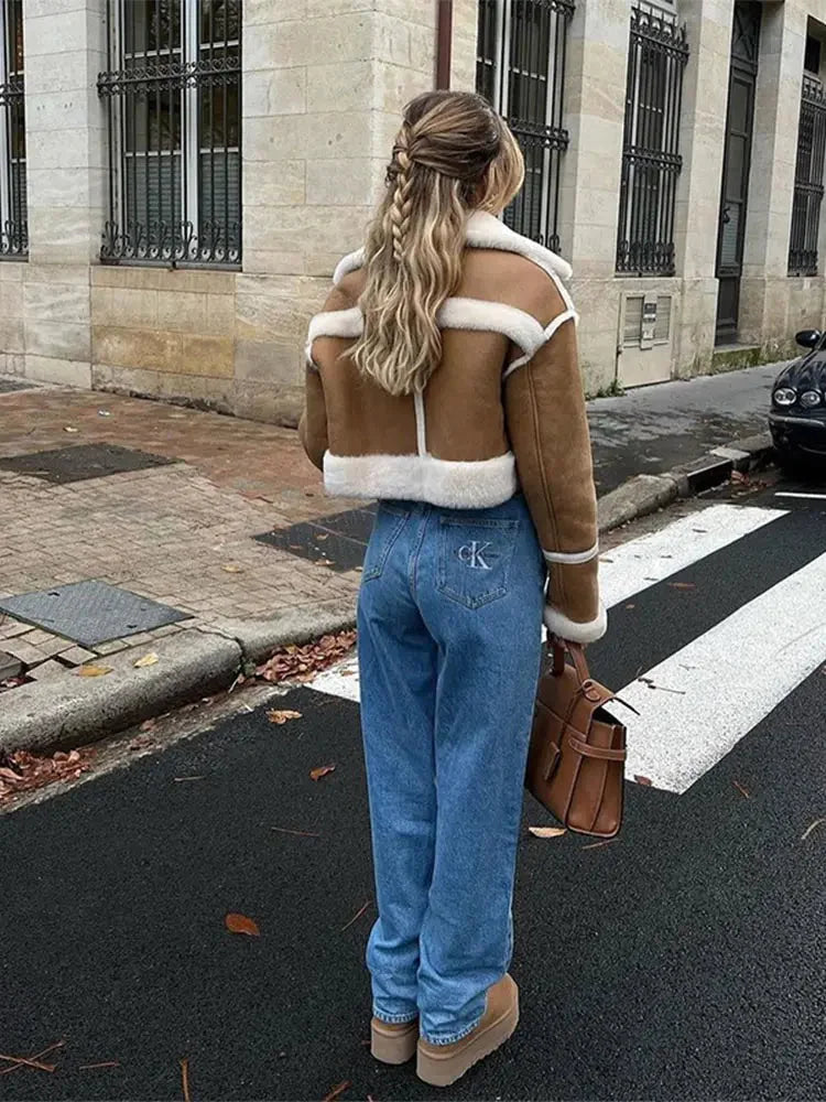 Women's cropped tan coat with white trim, featuring a tailored fit and soft fabric for a stylish layered look.