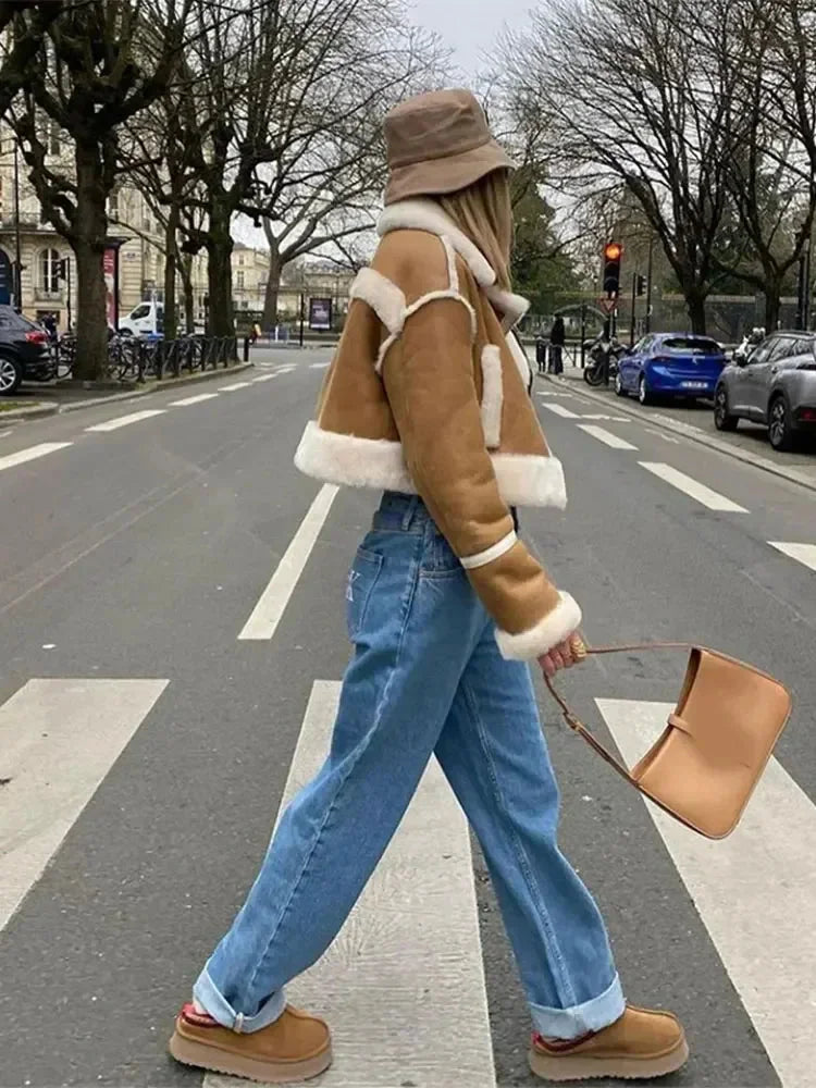 Women's cropped tan coat with white trim, made of soft cotton blend, featuring a button closure and stylish tailored fit.