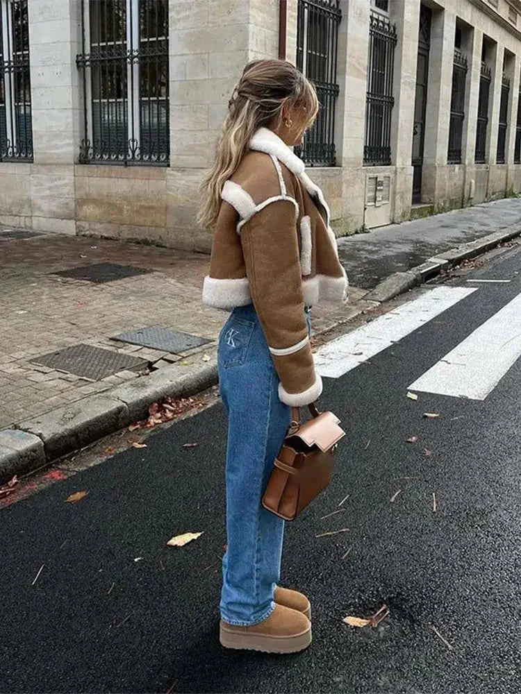 Women's cropped tan coat with white trim, featuring a soft fabric, button closure, and stylish boxy silhouette.