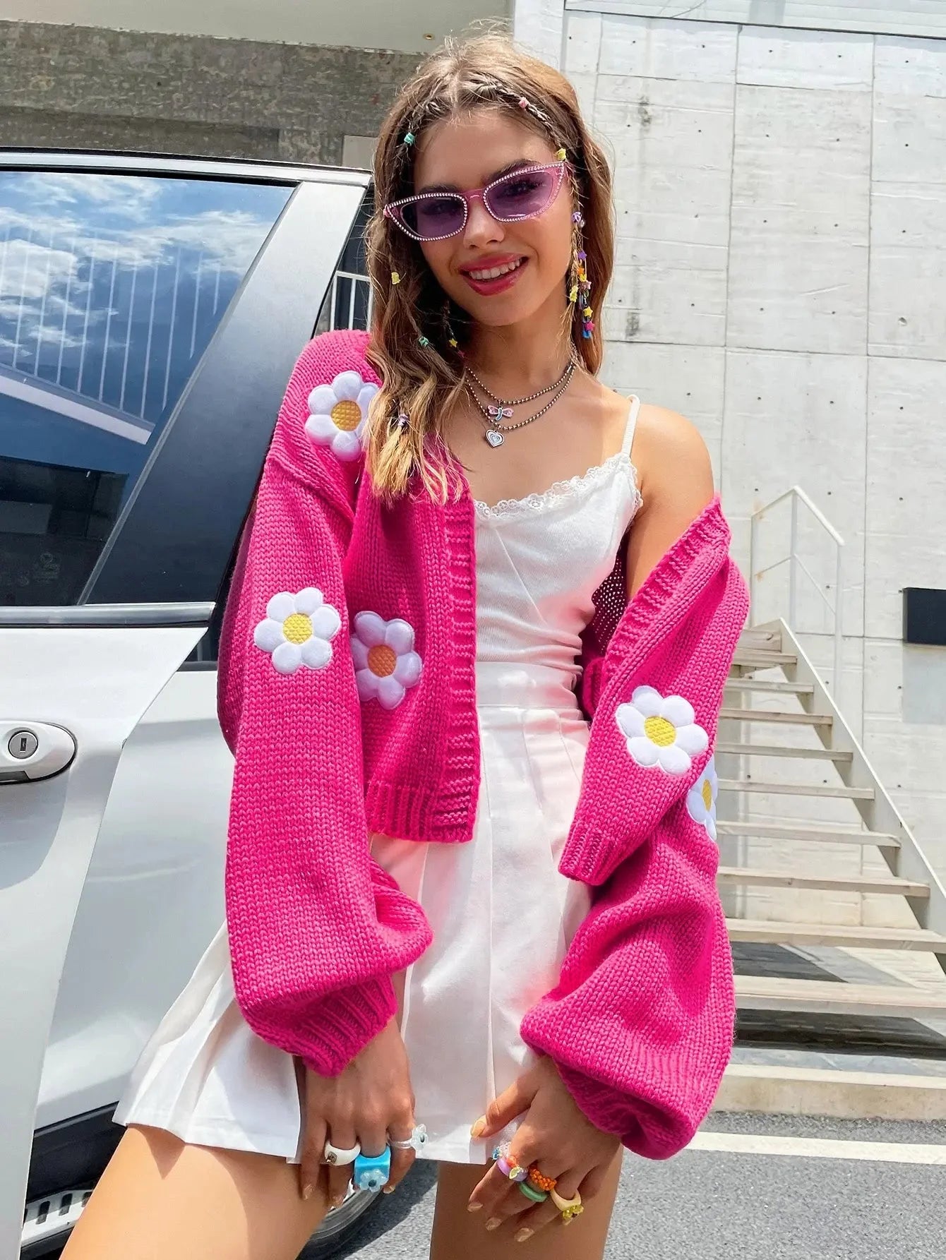 Women's open-front knitted cardigan featuring daisy embroidery, made from soft, breathable fabric for comfort and style.