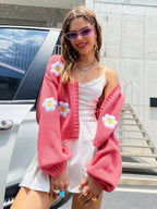 Women's open-front knitted cardigan with daisy embroidery, featuring soft fabric and a casual, lightweight design.