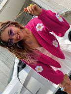 Women's open-front knitted cardigan featuring daisy embroidery, made from soft, breathable fabric for comfort and style.