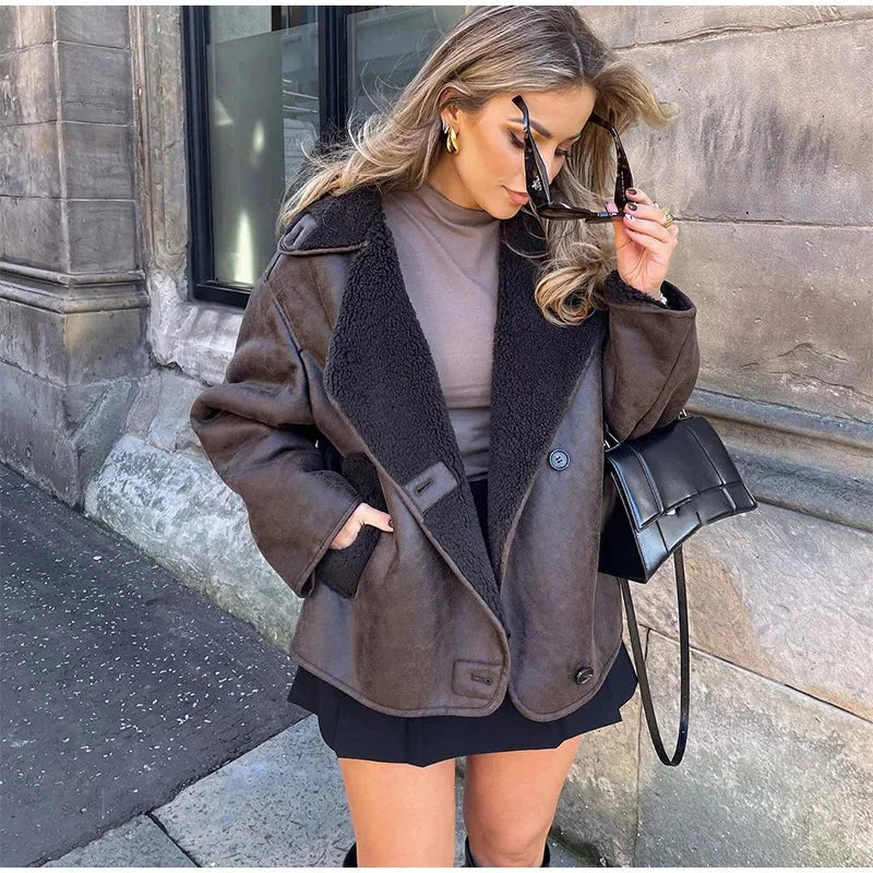Dark brown faux shearling coat for women featuring wide lapels and a cozy texture, perfect for chilly weather.