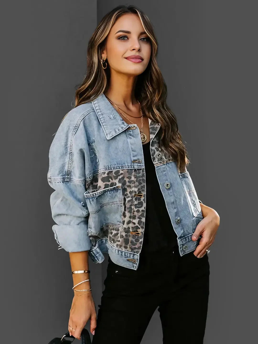 Women's denim jacket featuring leopard print accents, made from durable cotton with a classic button-up design and pockets.