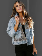 Women's denim jacket featuring a leopard print accent, made of durable cotton blend with button closures and classic styling.