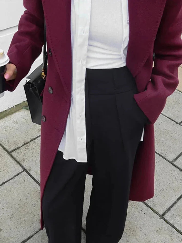 Women's double-breasted burgundy overcoat with lapel collar, made from warm wool blend, featuring a tailored fit and classic…