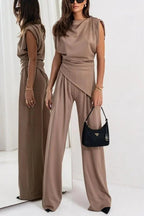 Women's two-piece set featuring draped design, wide pants, made from soft, breathable fabric for comfortable elegance.