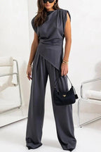 Women's draped two-piece set featuring a flowing top and wide pants made from soft, breathable fabric for comfort.