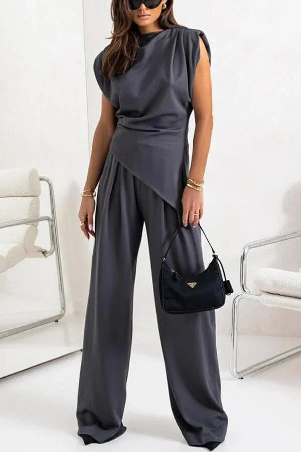 Women's draped two-piece set featuring a flowing top and wide pants made from soft, breathable fabric for comfort.