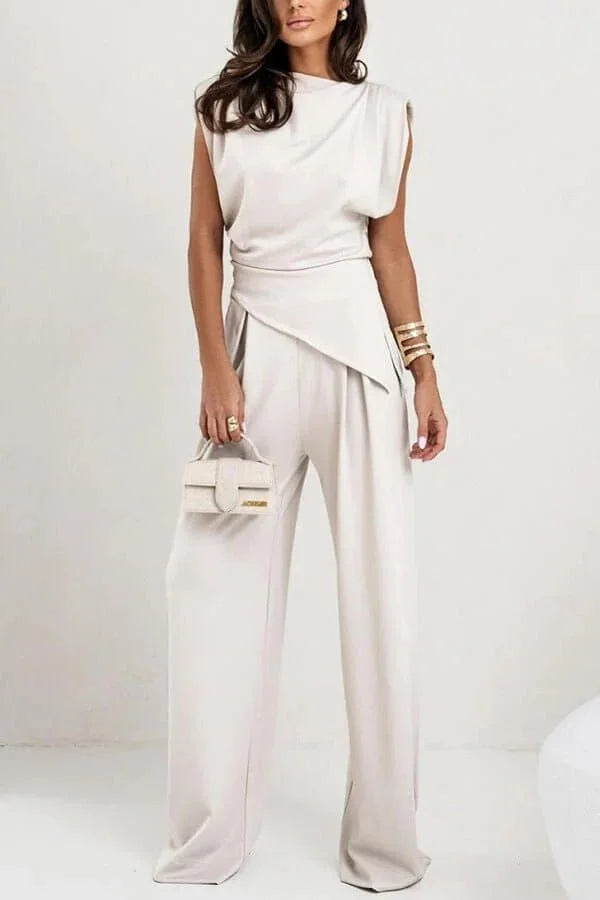 Women's elegant draped two-piece set featuring soft fabric, wide-legged pants, and a flowing top for a comfortable fit.