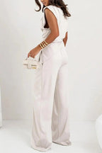 Women's elegant two-piece set featuring a draped top and wide pants, crafted from soft, breathable fabric for comfort.