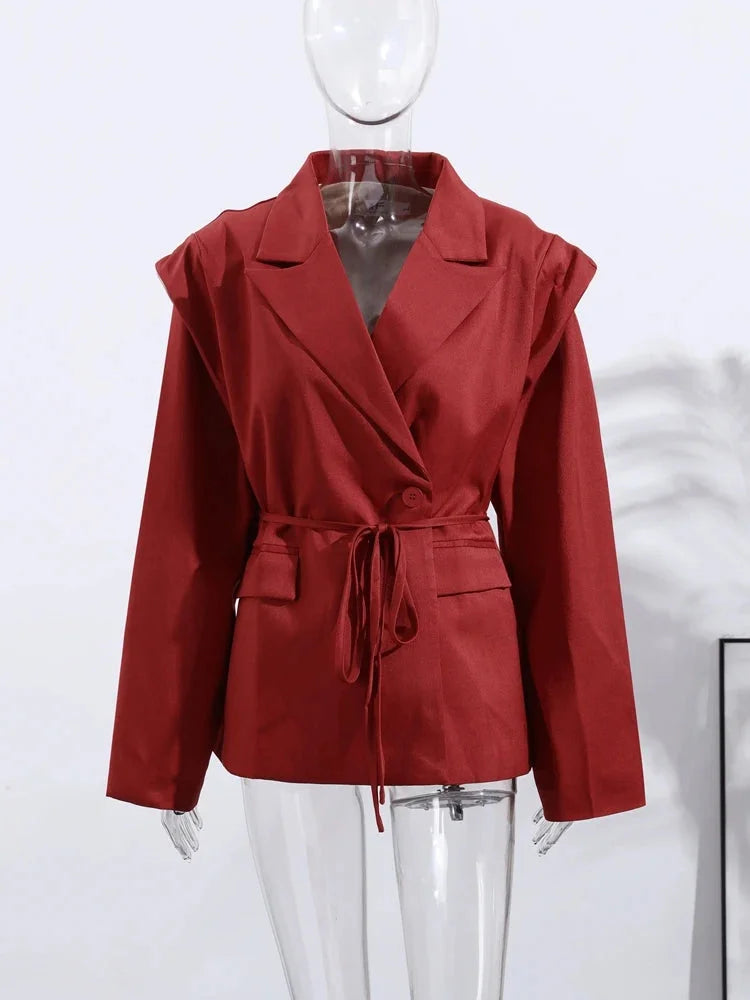Women's lace-up blazer featuring shoulder pads, crafted from soft fabric for a tailored fit and stylish silhouette.