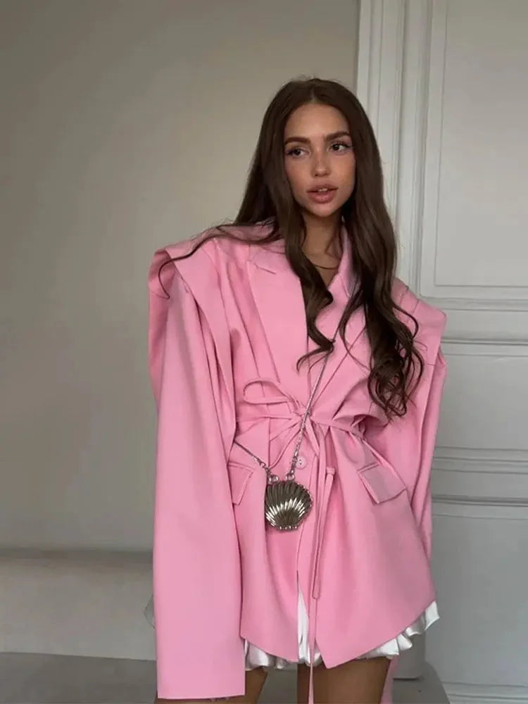 Women's lace-up blazer with shoulder pads, crafted from soft fabric, featuring a tailored design for a polished look.