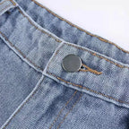 Women's flared jeans made of denim featuring red star detail and a classic high-waisted fit for a stylish, casual look.