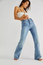Women's flared jeans made from soft denim featuring unique red star details on the pockets for a stylish touch.