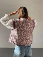 Women's Floral Boho Vest made of lightweight fabric, featuring vibrant ethnic prints and a relaxed fit for casual layering.