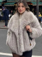 Women's fluffy jacket with oversized collar, featuring soft fabric, relaxed fit, and a cozy design perfect for cooler…