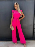 Lightweight cotton jumpsuit featuring flutter sleeves, wide-leg design, and a bow tie at the waist for a flattering fit.