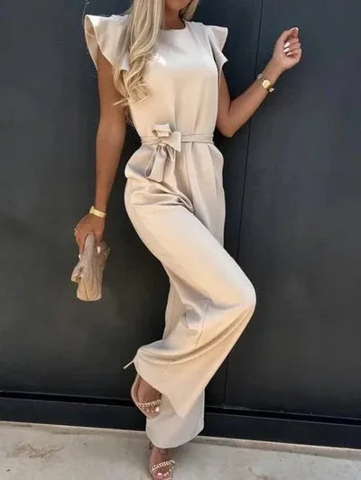 Women's wide-leg jumpsuit with flutter sleeves, bow tie detail, and soft, breathable fabric for comfort and style.