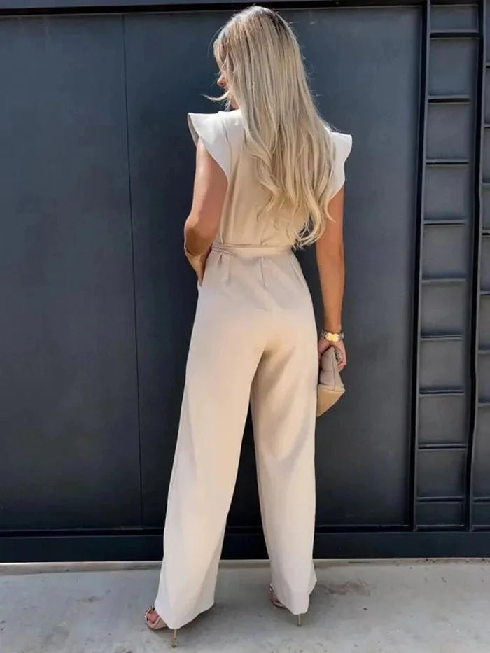Women's flutter-sleeve wide-leg jumpsuit in soft fabric, featuring a bow tie detail and a relaxed fit for comfort.