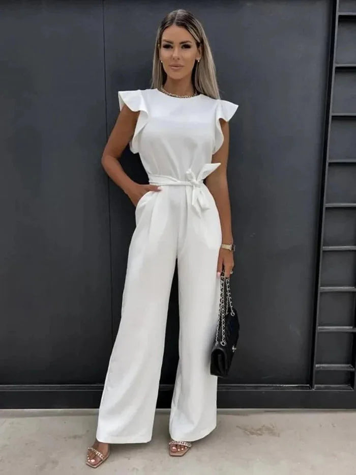 Women's wide-leg jumpsuit in soft fabric, featuring flutter sleeves and a stylish bow tie at the waist for a relaxed fit.