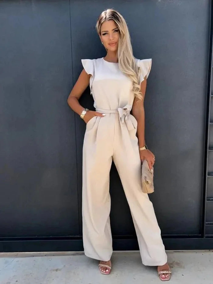 Women's wide-leg jumpsuit with flutter sleeves, bow tie detail, made from soft, breathable fabric for comfort and style.