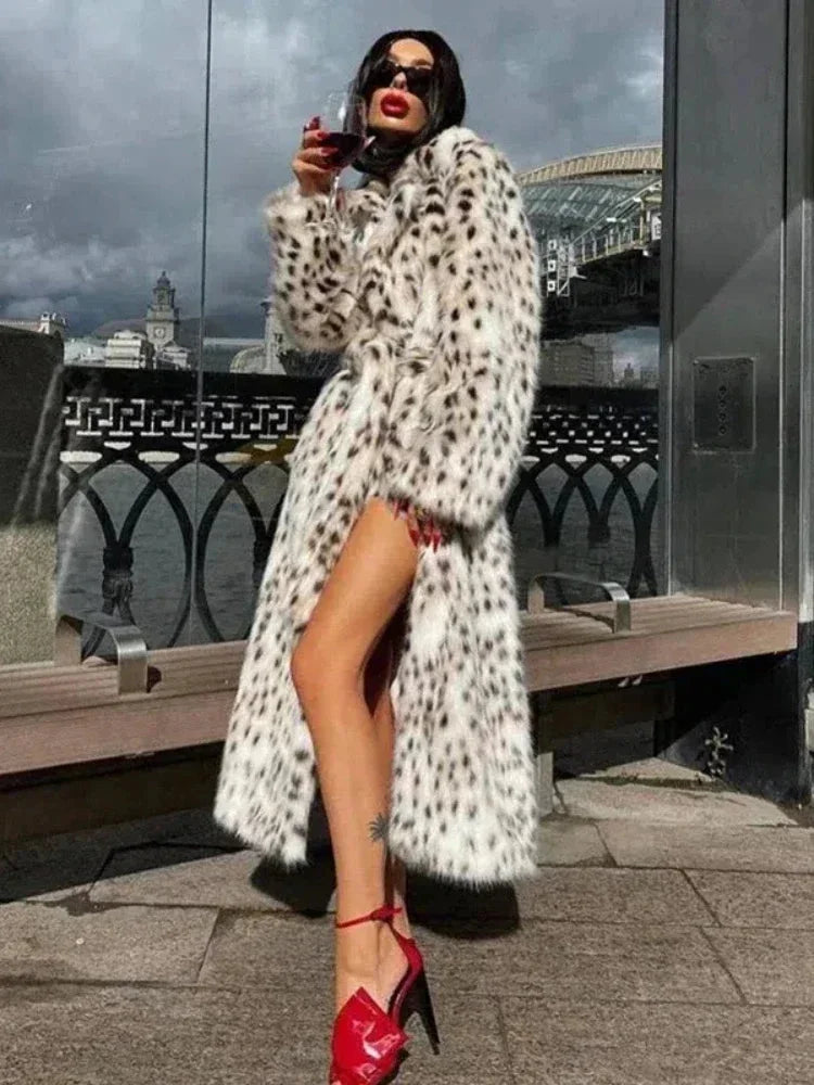 Women's full-length leopard print coat featuring a classic collar, made from soft fabric with a stylish, bold animal pattern.