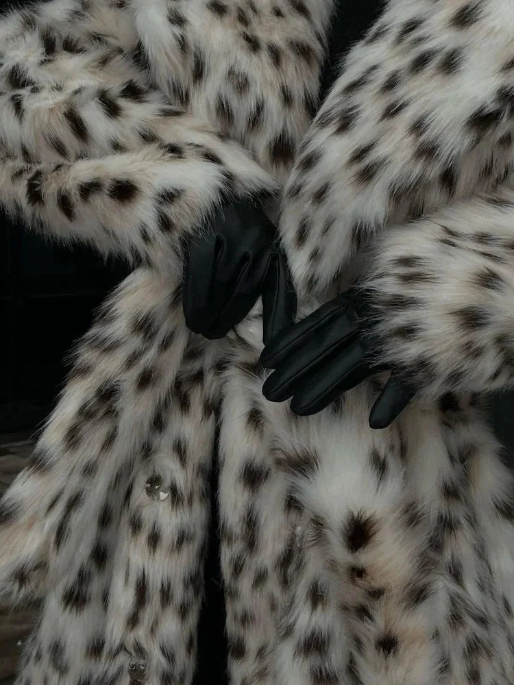 Women's full-length leopard print coat with collar, made from soft fabric, featuring a classic silhouette and stylish design.