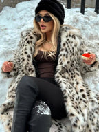 Women's full-length leopard print coat with collar, featuring a warm fabric and stylish design for a bold, fashionable look.
