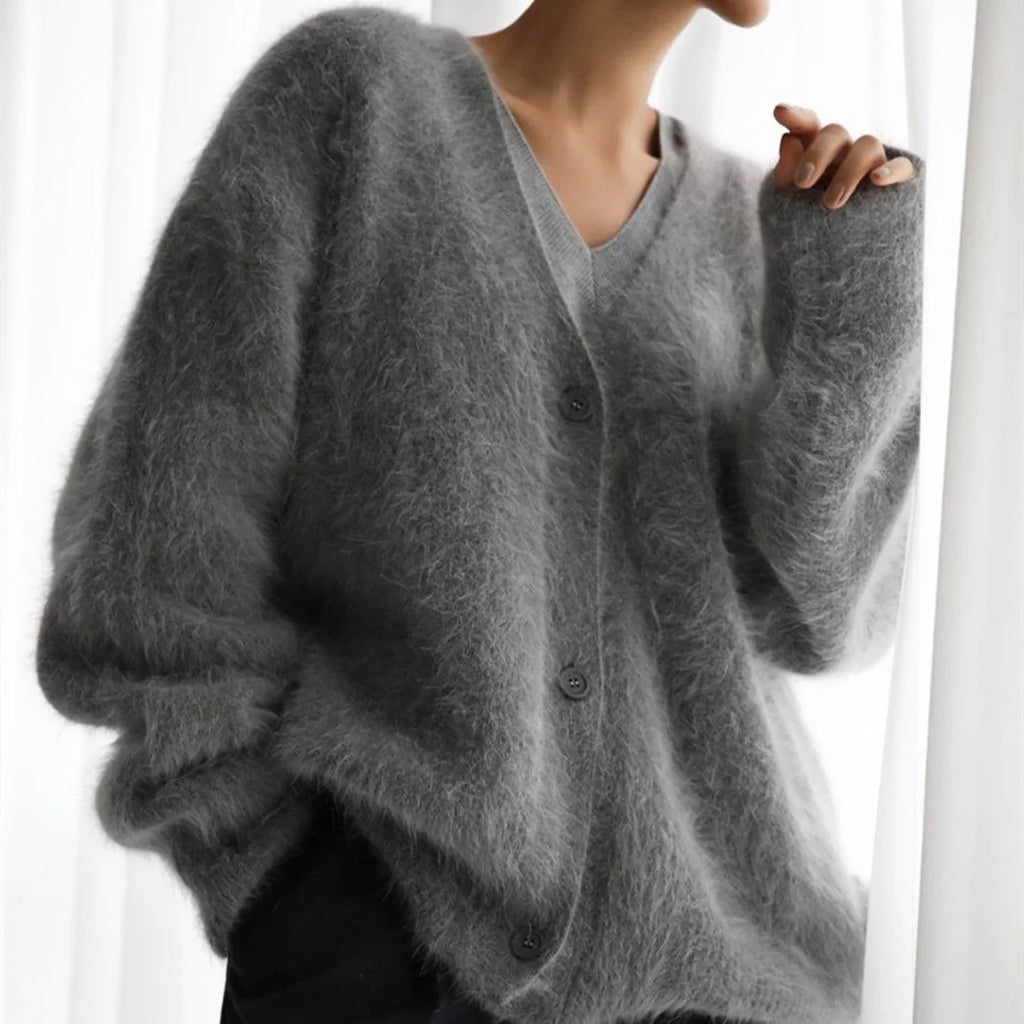 Women's oversized cardigan in fuzzy knit with button-front design, featuring a relaxed fit and cozy texture for warmth.