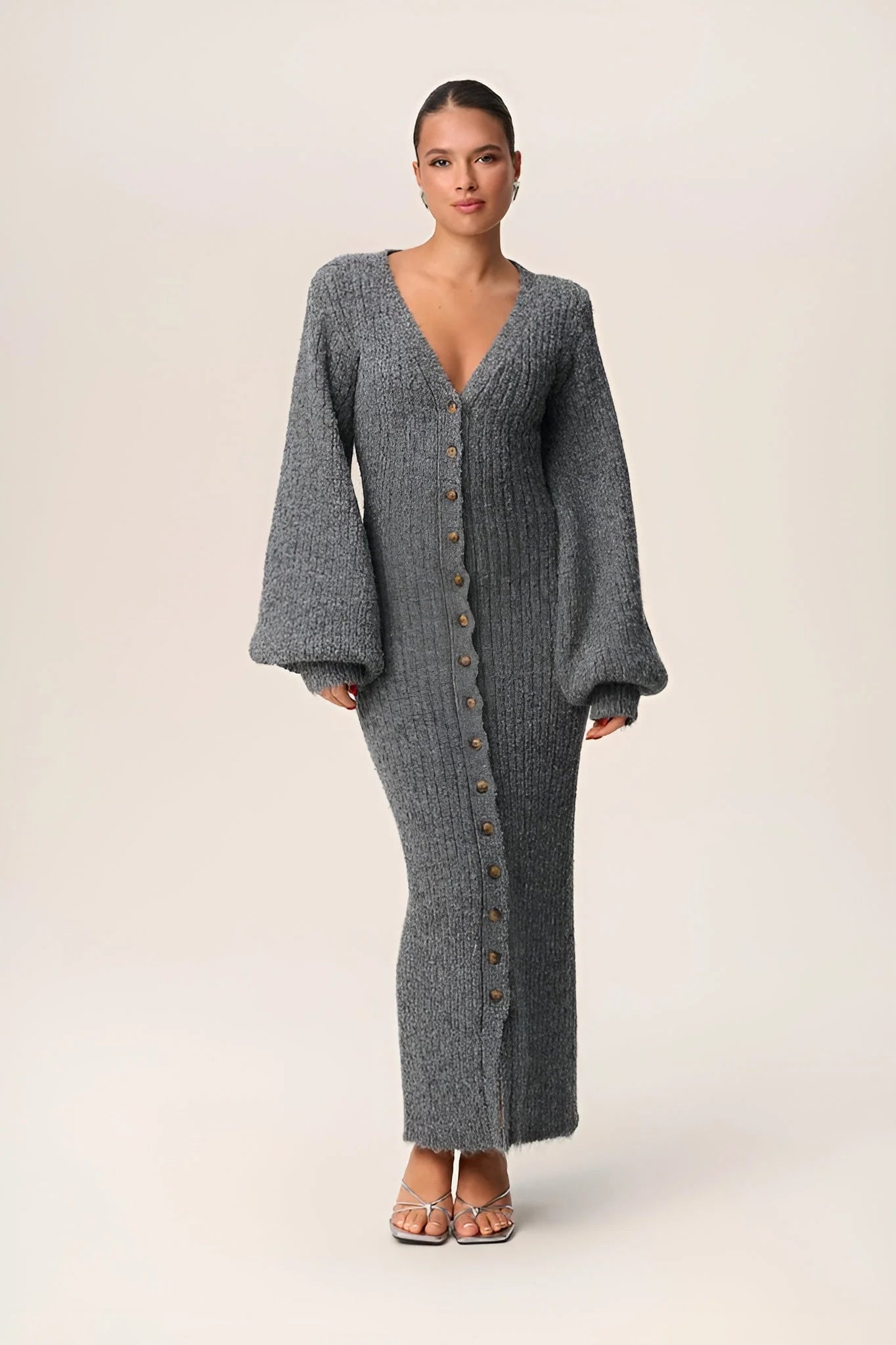 Women's gray maxi dress featuring a button front, long sleeves, and soft fabric, perfect for casual or semi-formal occasions.