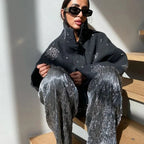 Women's grey jacket featuring intricate embroidery and bat sleeves, made from soft, breathable fabric for comfort.