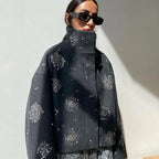 Women's grey jacket featuring embroidered designs and bat sleeves, made from soft fabric for a comfortable fit.