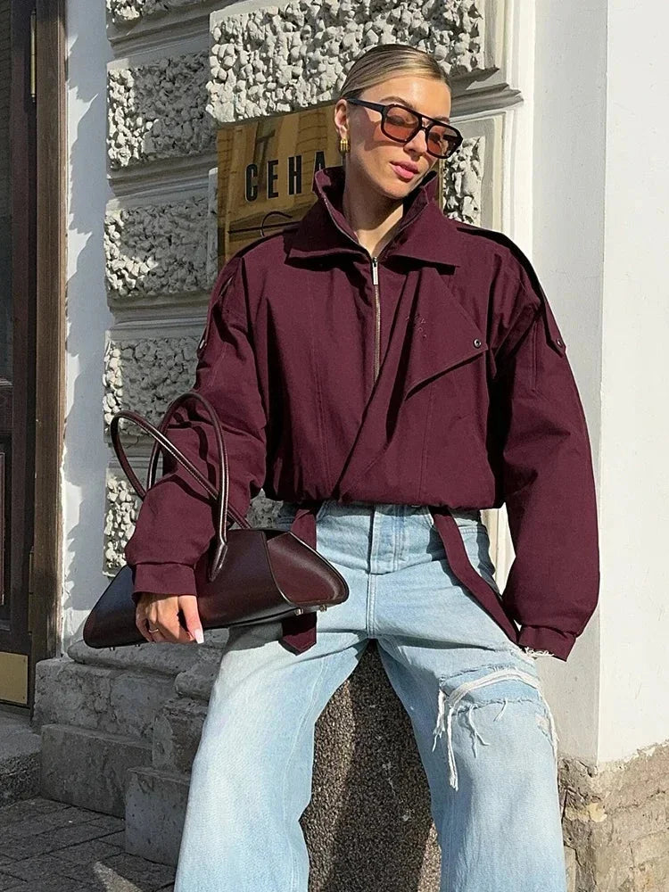 Women's high collar bomber jacket featuring functional pockets, durable fabric, and a stylish, streamlined design.
