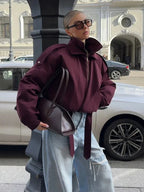 Women's high collar bomber jacket in durable fabric, featuring functional pockets and a stylish, streamlined design.