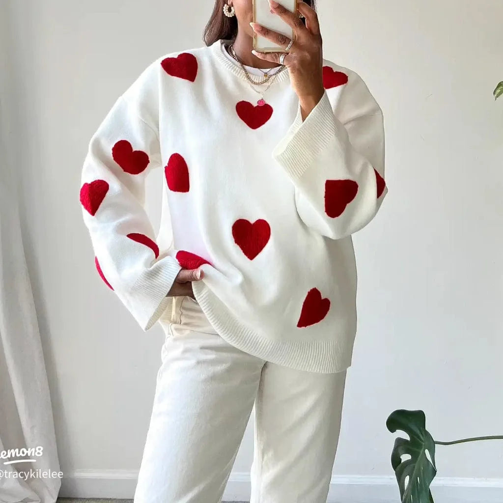 Women's ivory sweater made of soft knit, featuring a casual red heart pattern for an everyday comfy look.