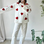 Ivory women's sweater made of soft cotton, featuring a red heart pattern, perfect for casual wear and everyday comfort.