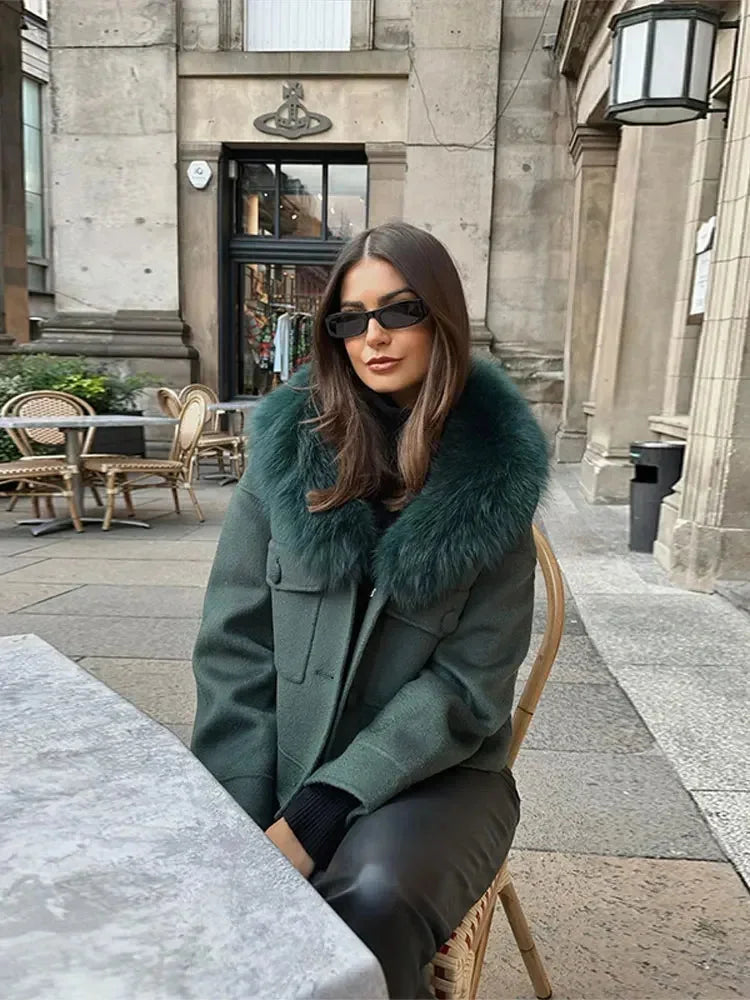 Charcoal gray women's jacket featuring a faux fur collar, crafted from warm fabric with a stylish, fitted design.