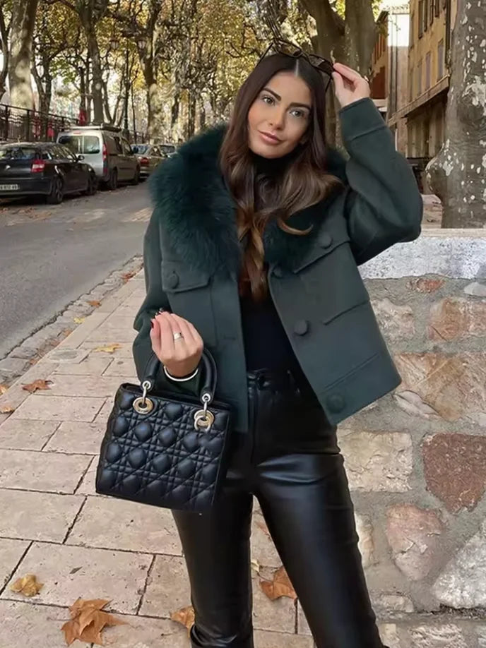Charcoal gray women's jacket featuring a faux fur collar and a stylish design, perfect for cool weather.
