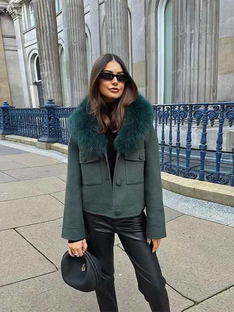 Charcoal gray women's jacket featuring a soft faux fur collar and a fitted design for warmth and style.