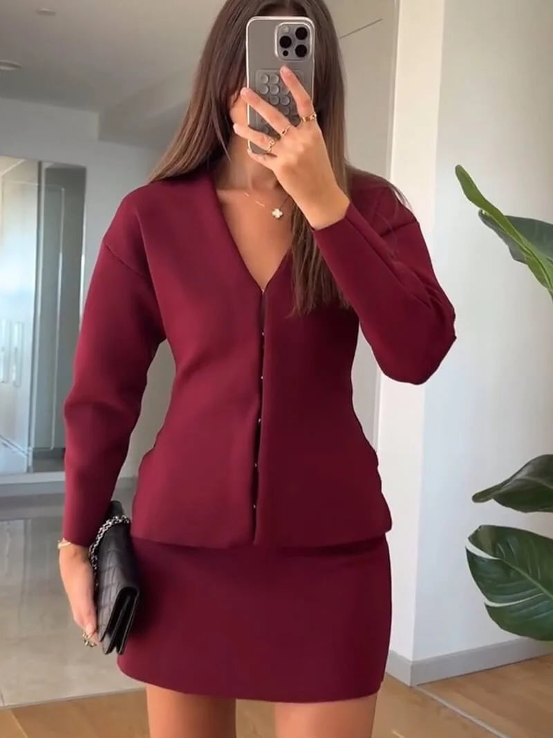 Women's knit skirt set featuring a soft fabric and a stylish long sleeve top with ribbed detailing for comfortable wear.