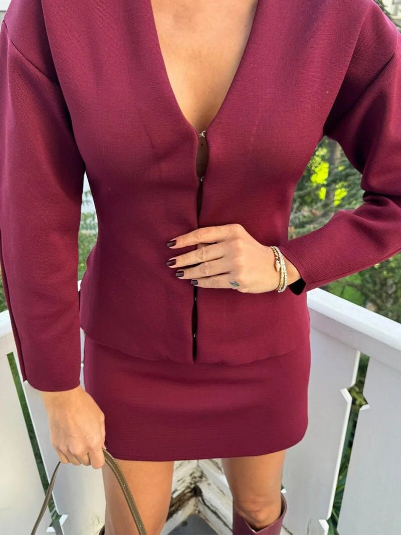 Women's knit skirt set featuring a fitted long sleeve top, soft fabric, and a comfortable stretch for everyday wear.