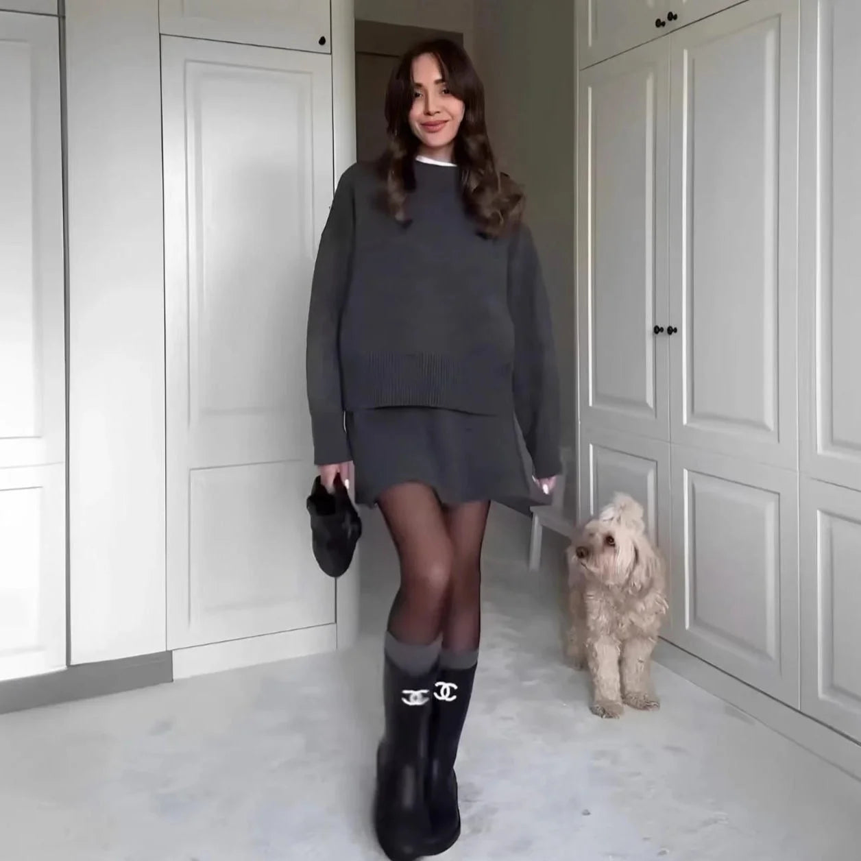 Women's knit sweater and skirt outfit set in soft cotton, featuring a relaxed fit and matching design for effortless style.