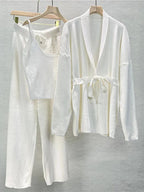 Women's knitted cardigan and pants set featuring a belted design, cozy fabric, and a relaxed fit for everyday comfort.
