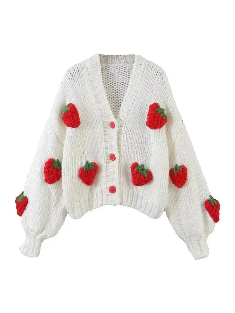 Women's knitted cardigan featuring a playful strawberry pattern, made from soft cotton blend for comfort and warmth.