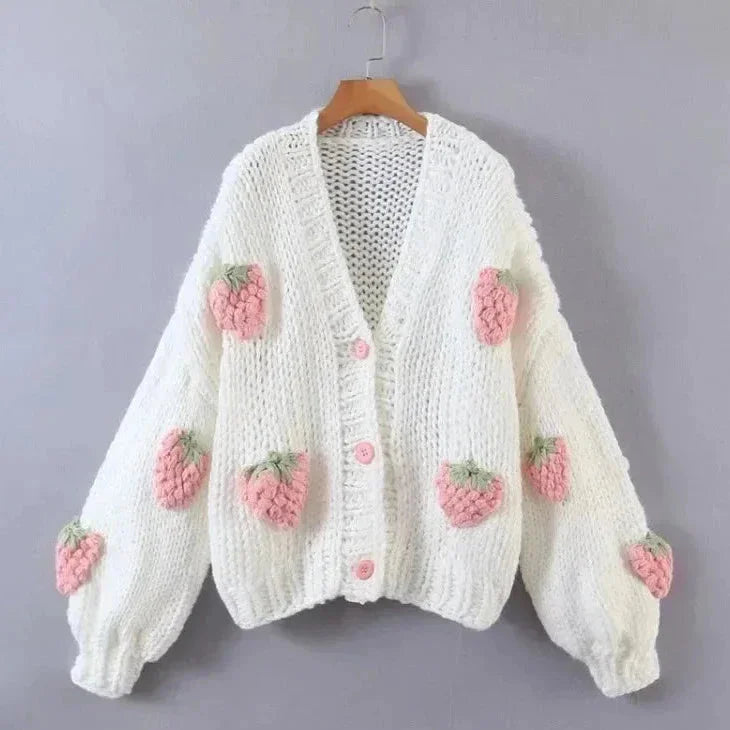 Women's knitted cardigan featuring a playful strawberry pattern, crafted from soft, breathable cotton for everyday comfort.
