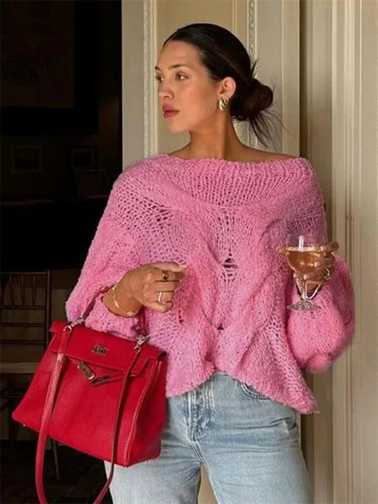 Lightweight women's knitted sweater with a loose fit, featuring a cozy texture and casual style for everyday wear.