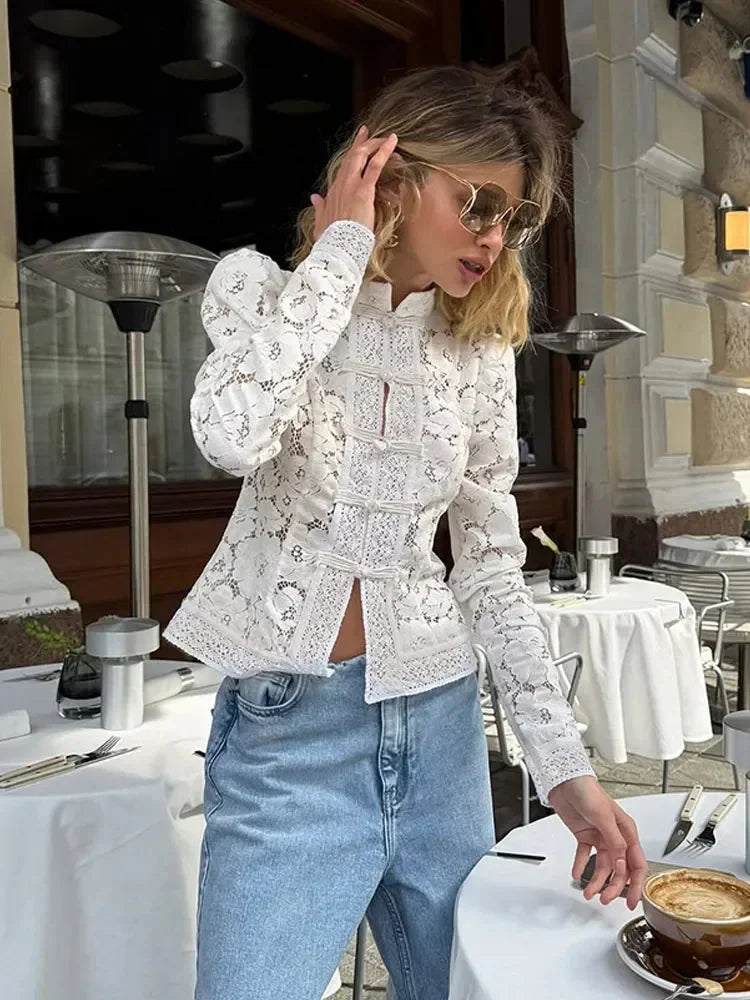 Women's lace blouse with stand neck, long sleeves, intricate floral design, and soft breathable fabric for comfort and style.