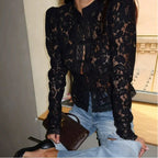 Women's lace blouse featuring a stand neck, long sleeves, and intricate floral patterns in lightweight fabric.